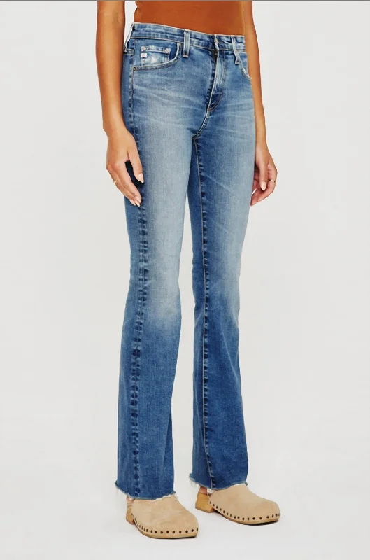 Round neck design Denim Farrah Boot Jeans In Medium Indigo Wash